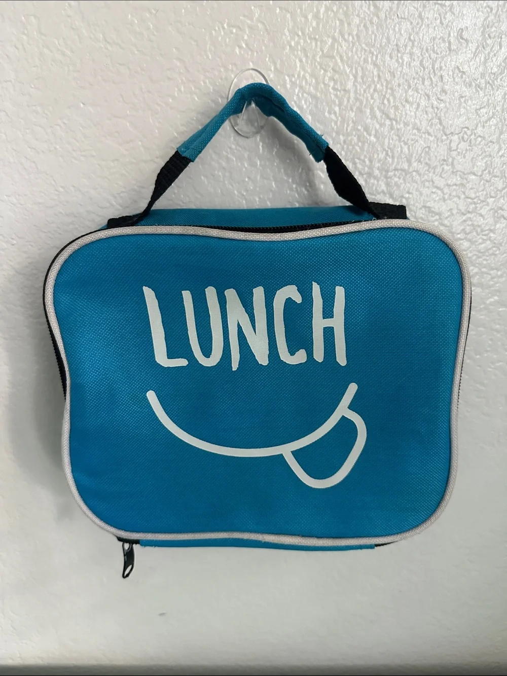 Walmart blue insulated lunch box with a minimalist white ’LUNCH’ graphic-used